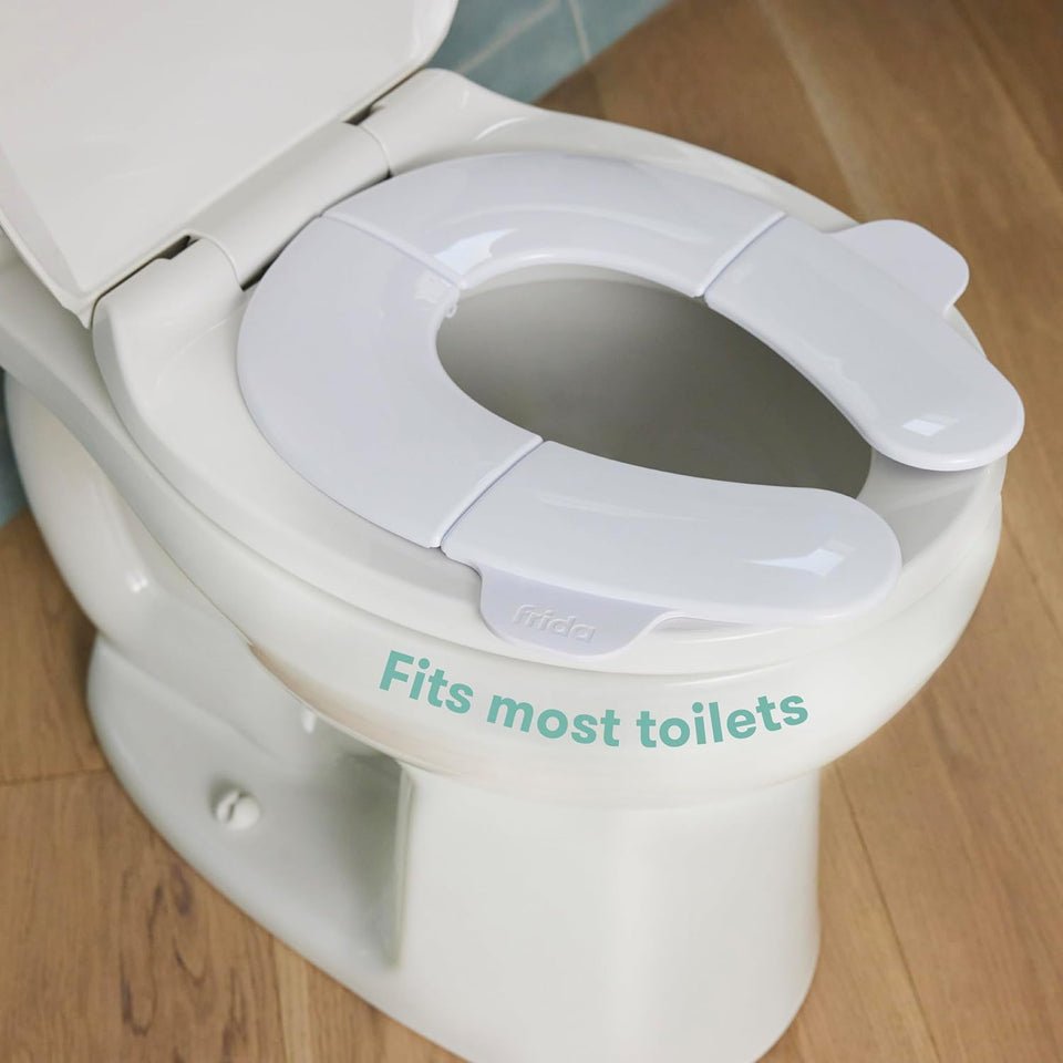 Frida Baby Fold-and-Go Portable Potty Seat for Toilet, Foldable Travel Potty Seat for Toddler, Fits Round & Oval Toilets, Non-Slip Base, Handles, Includes Free Travel Bag